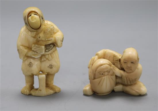 Two early 20th century Japanese ivory netsuke of a peasant woman with swivelling face and a doll maker, (559, 586)